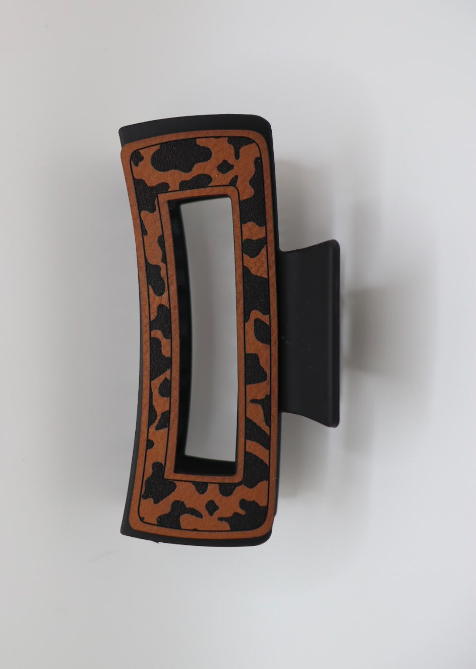 Open cow print hair claw clip with leather detailing