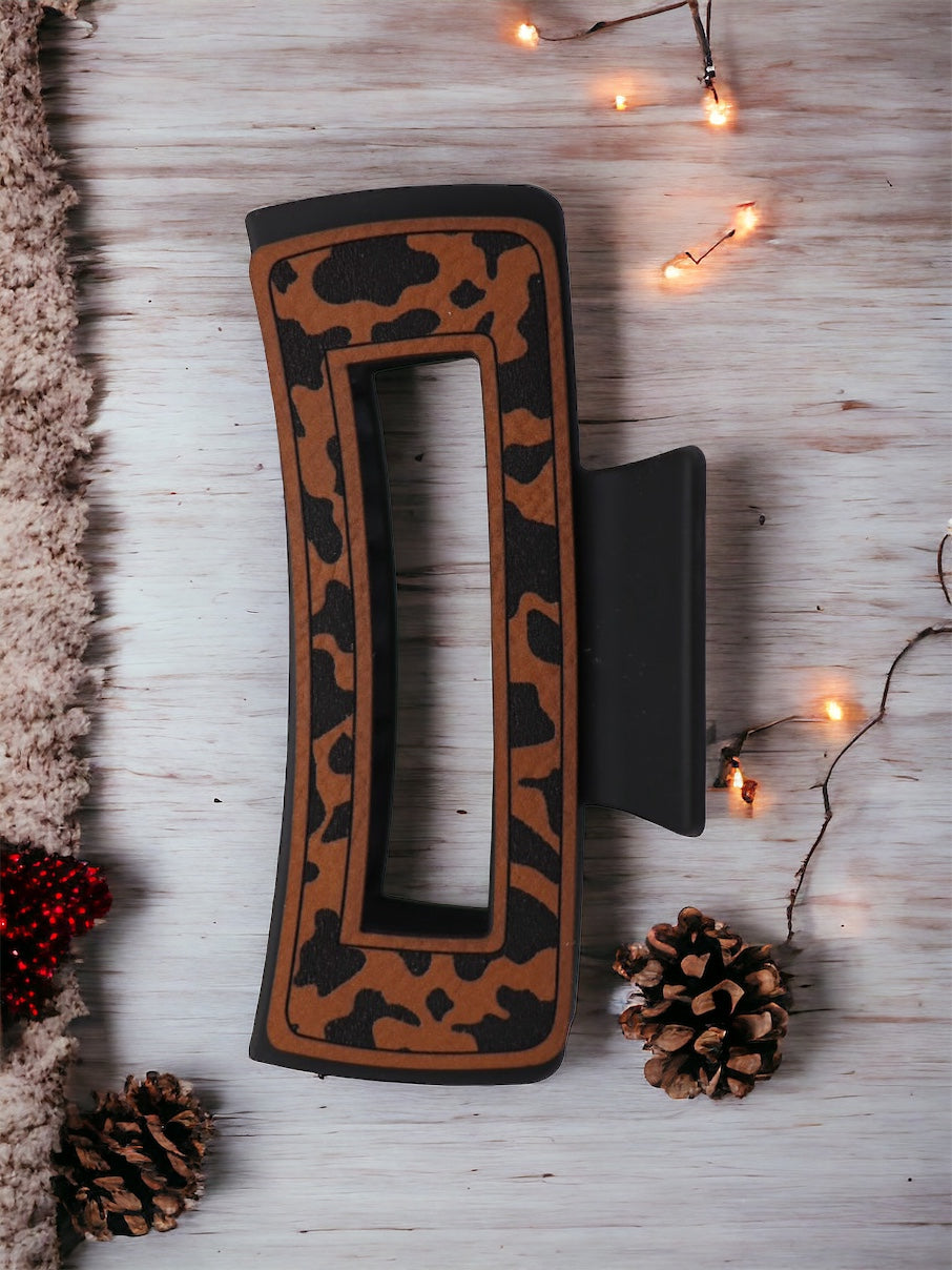 Open cow print hair claw clip with leather detailing