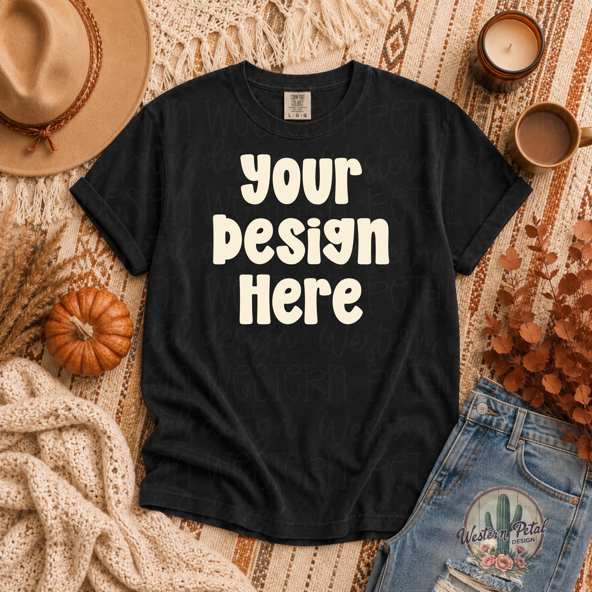 Comfort Colors black t shirt mockup styled in a cozy fall flat lay with pumpkins, denim jeans, warm boho textures, coffee mug, and autumn decor.