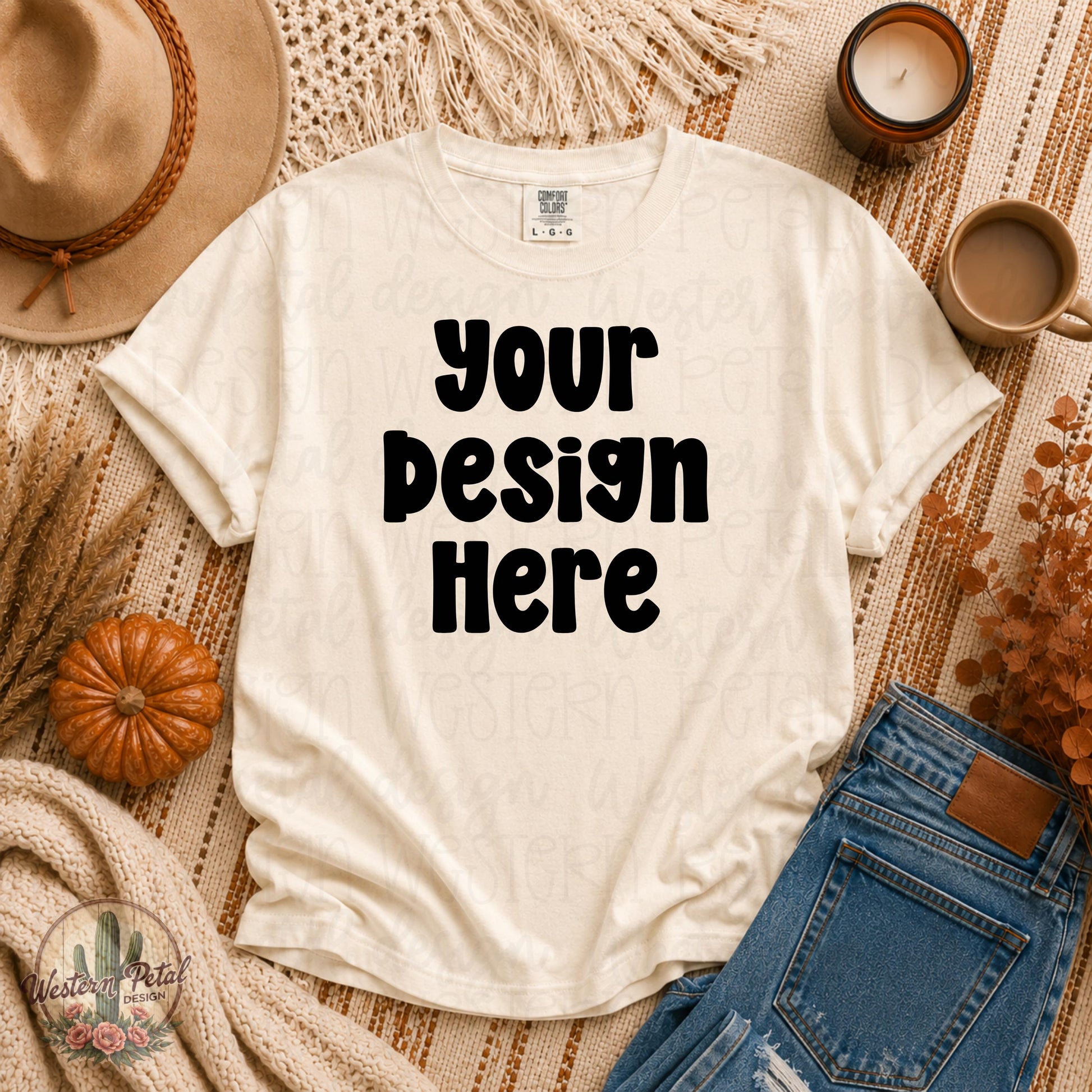 Comfort Colors ivory t shirt mockup styled in a cozy fall flat lay with pumpkins, denim jeans, candles, warm boho textures, and autumn decor.
