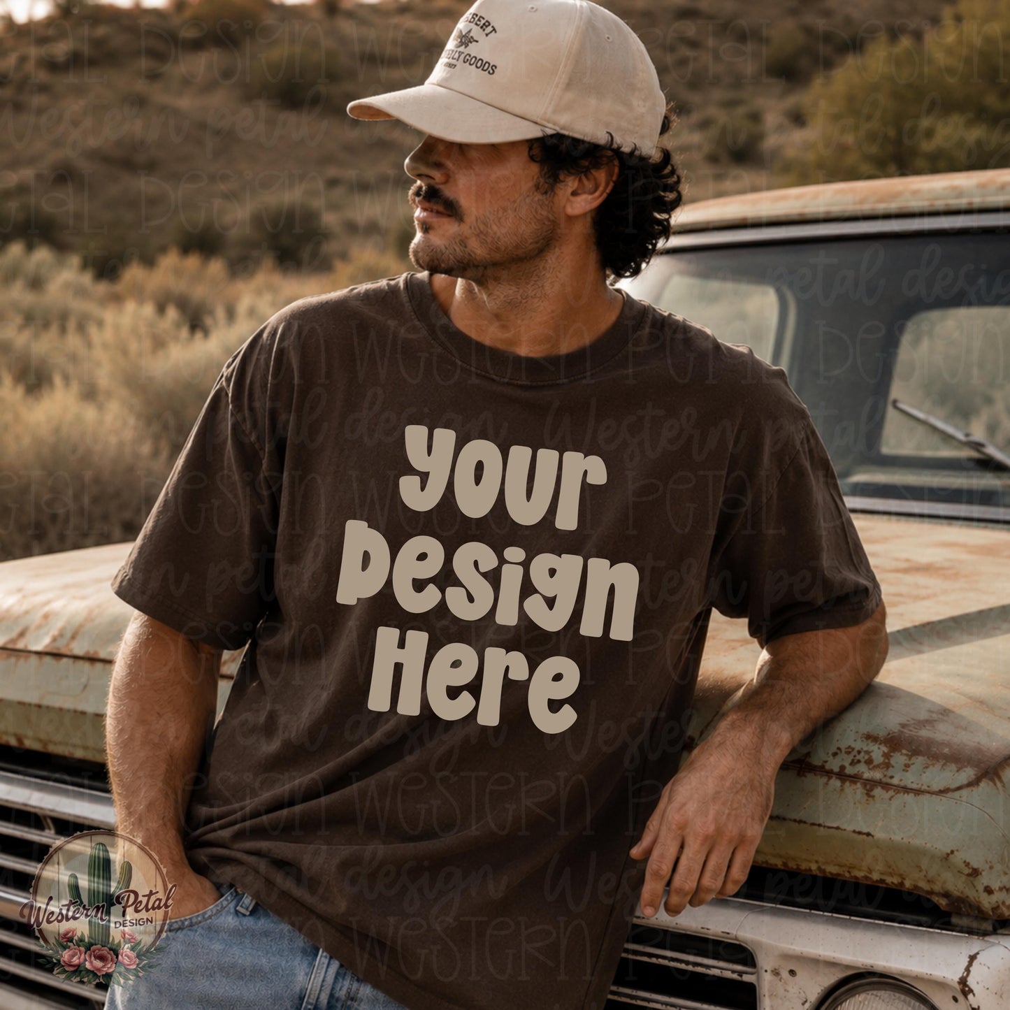 Rugged western-style male mockup wearing a blank Comfort Colors 1717 espresso brown t-shirt while leaning against a vintage truck in a desert landscape. Neutral earthy tones with masculine outdoors aesthetic perfect for western or boutique apparel mockups.