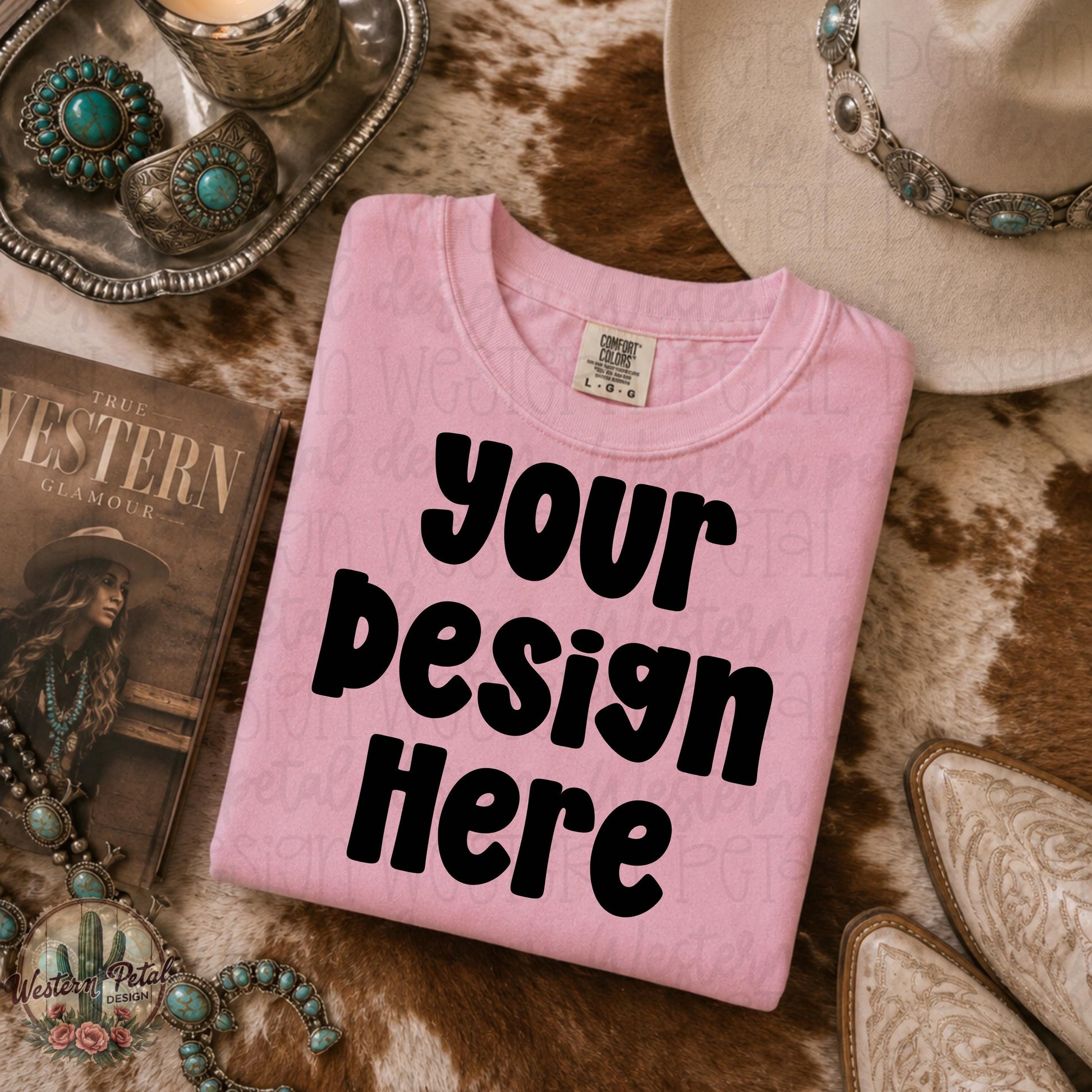 Blossom pink Comfort Colors folded shirt mockup styled on western cowhide rug with turquoise jewelry cowboy hat and western glam decor