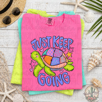 Bright neon pink Comfort Colors 1717 graphic tee with colorful turtle design and “Just Keep Going” phrase displayed in a beachy boho flat lay mockup with woven decor and sandals.