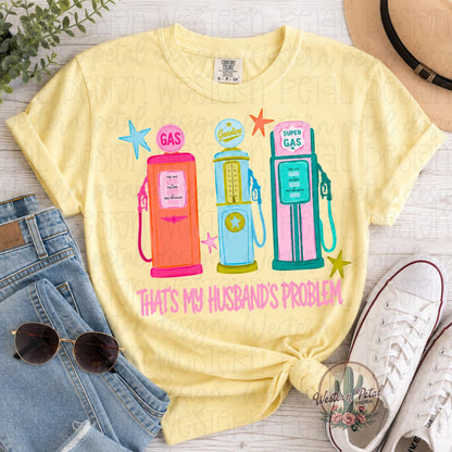 Comfort Colors 1717 butter yellow t-shirt featuring colorful retro gas pumps with the phrase “That’s My Husband’s Problem” in pink lettering.