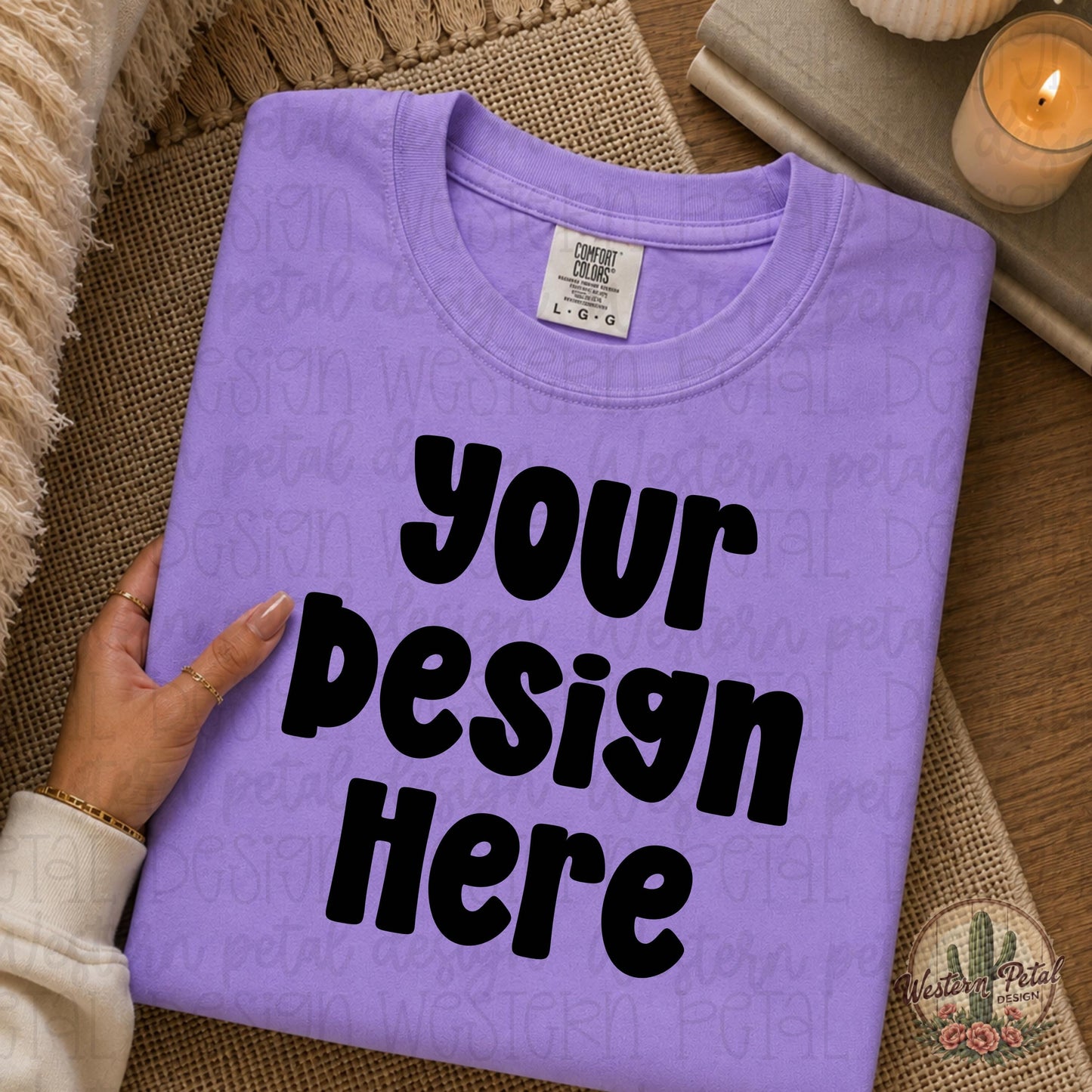 Lavender Comfort Colors folded shirt mockup with feminine boho styled flat lay and woman hand holding shirt corner