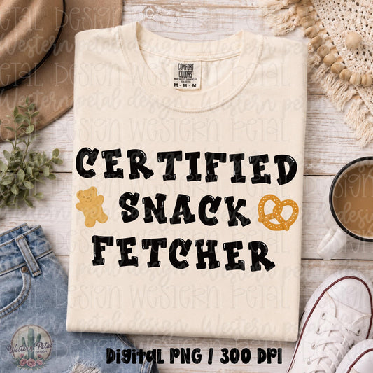 Funny Certified Snack Fetcher PNG design with bold black retro lettering, smiling cracker cookie, and pretzel snack illustrations for toddler moms and motherhood apparel.